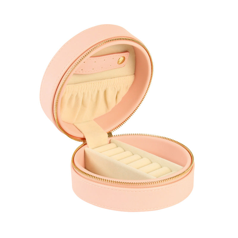 Boite à bijoux ronde gainée synthétique matelassée rose